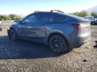 2023 Tesla Model Y VIN 7SAYGDEEXPF598767 auction photo 1